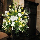 White and gold floral arrangement by the pulpit in Ashover Church